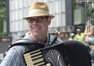 Peter performing accordion in Bryant Park, NYC